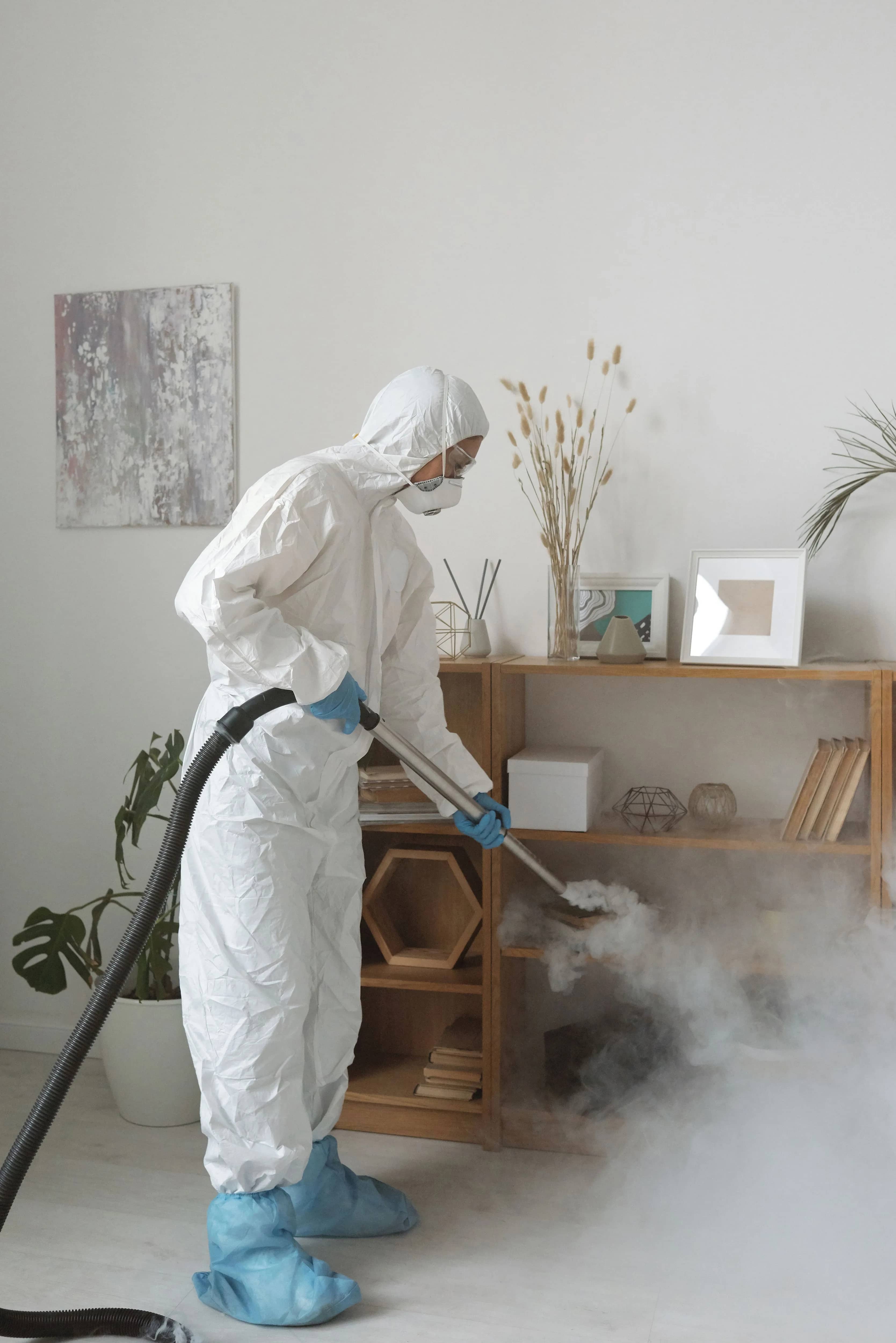 Cleaner sanitising a short-let property between guest stays